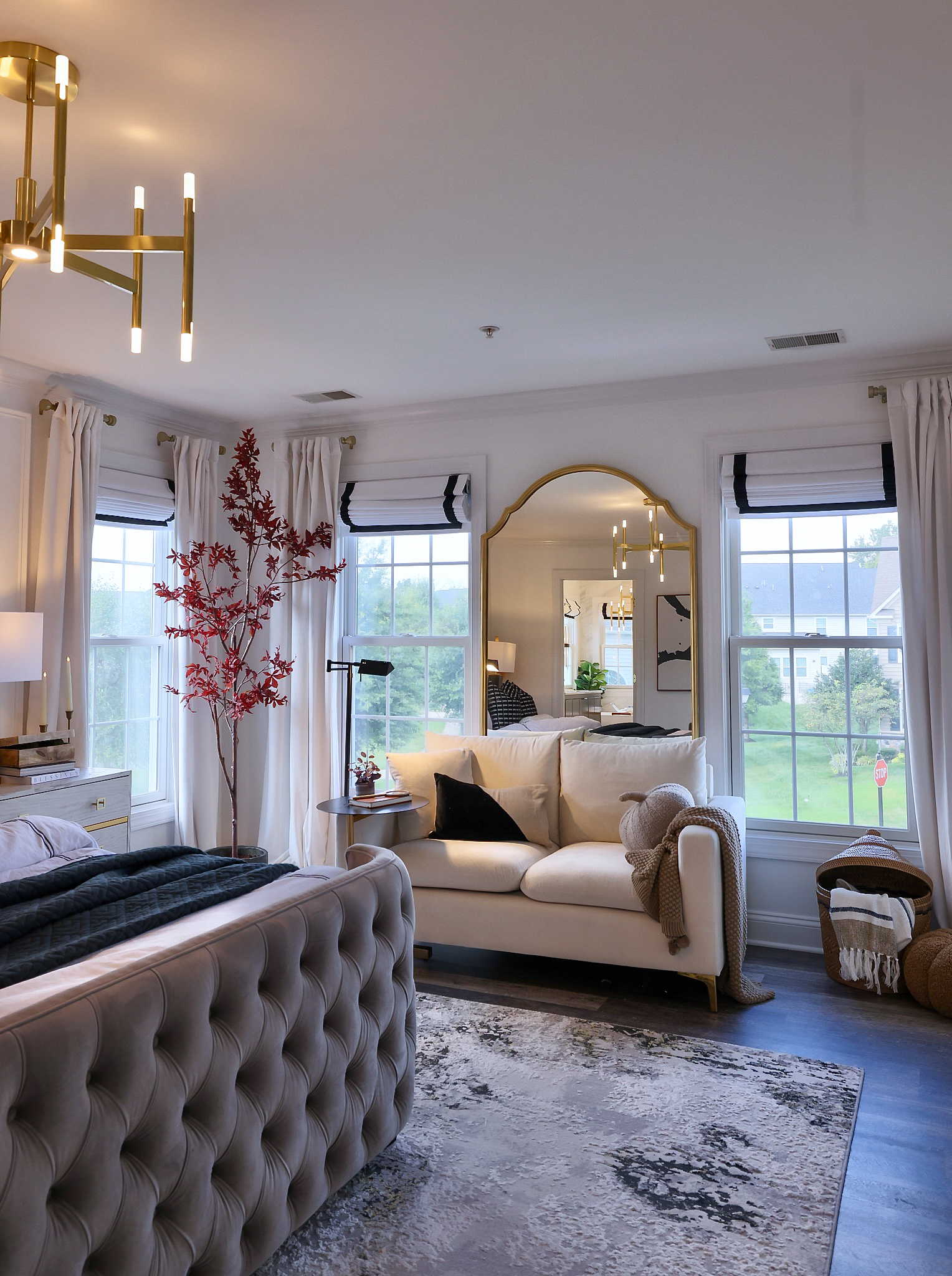 a modern bedroom with blinds.com roman shade bedroom window coverings