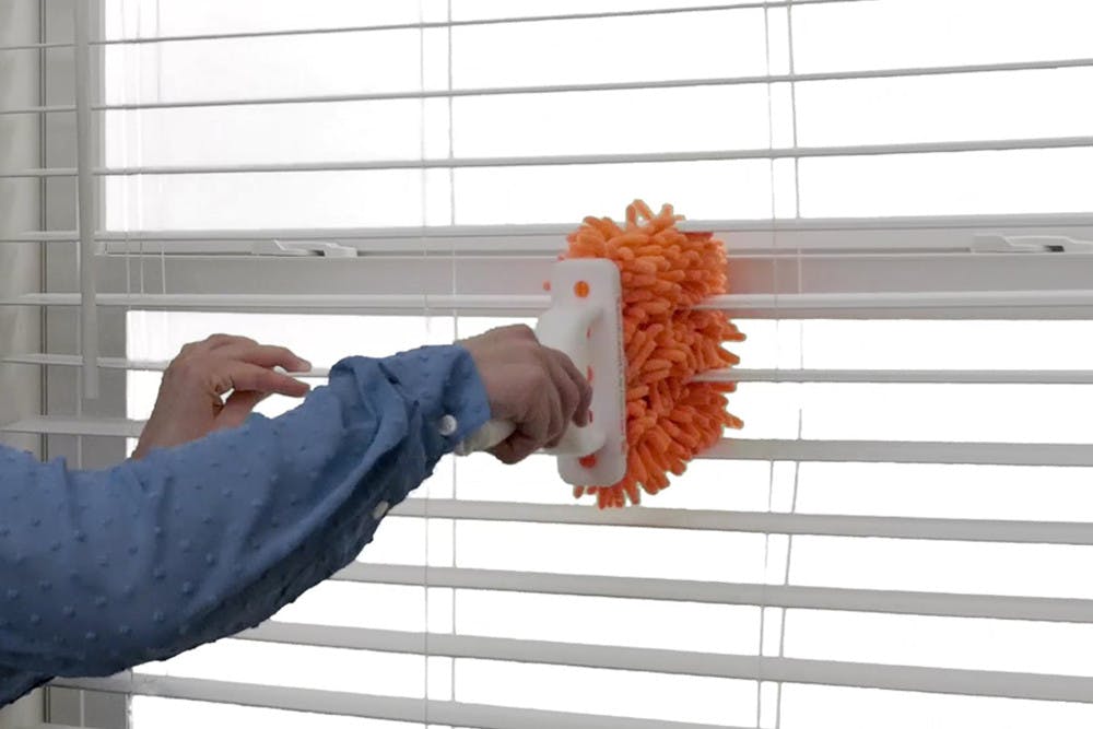 Orange microfiber blinds duster.