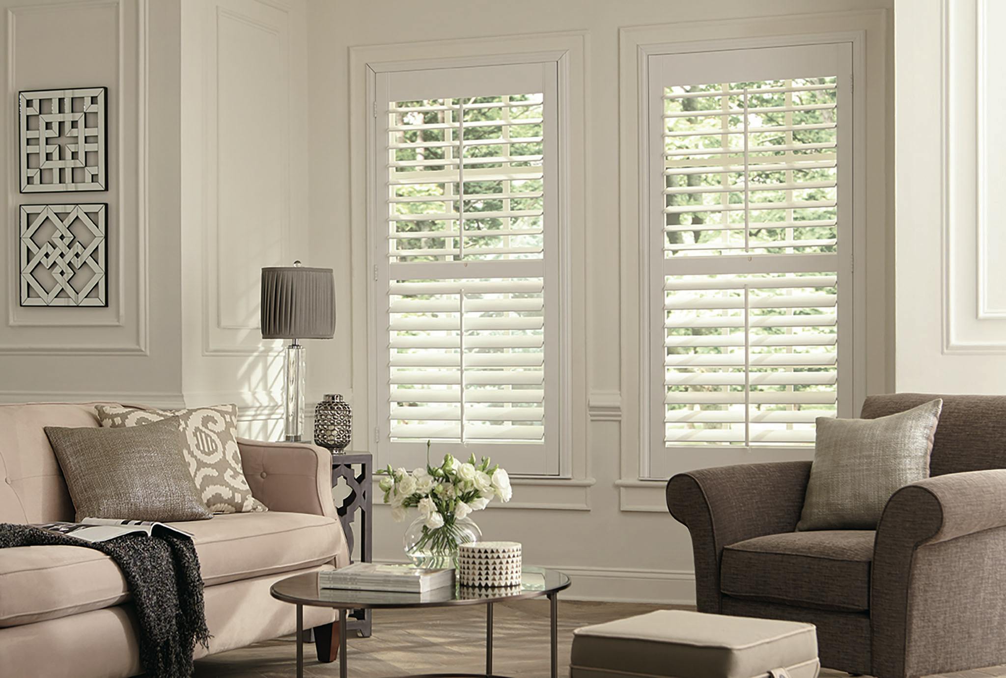 white wood shutters open in living room couch and chair
