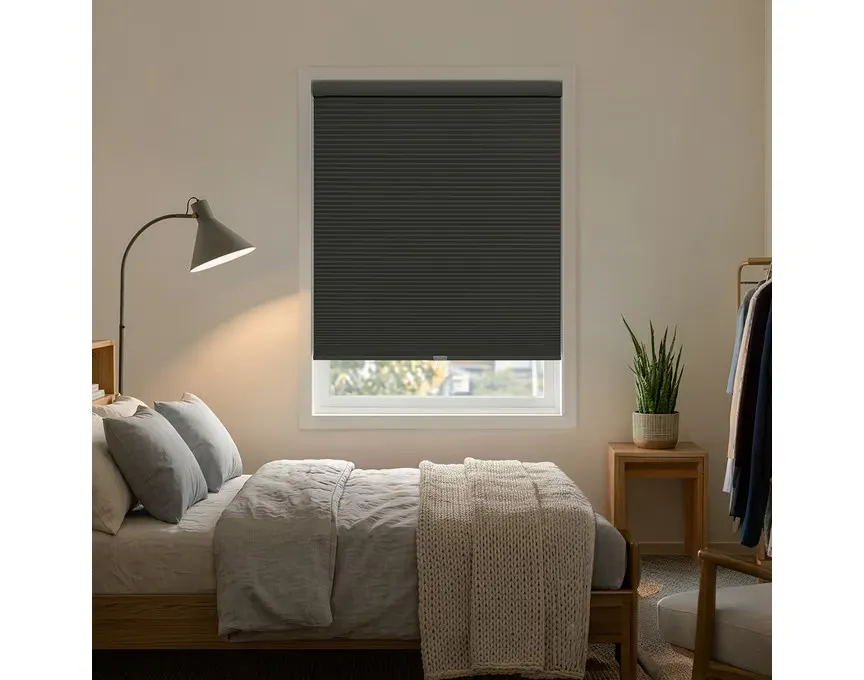 EZGrip No Drill Blackout Cordless Cellular Shades in a bedroom, offering light control, privacy, and easy installation without drilling.