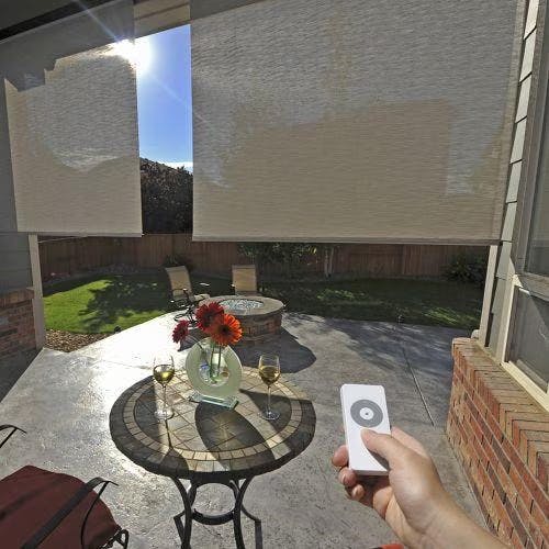 Motorized Blinds.com Outdoor Solar Shades on a patio with remote control