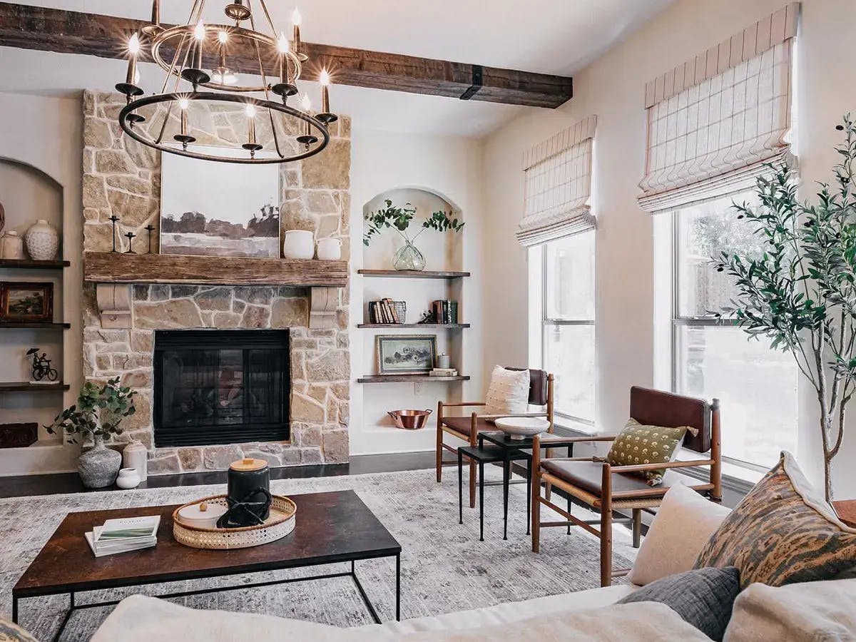 Neutral-colored living room with roman shades.