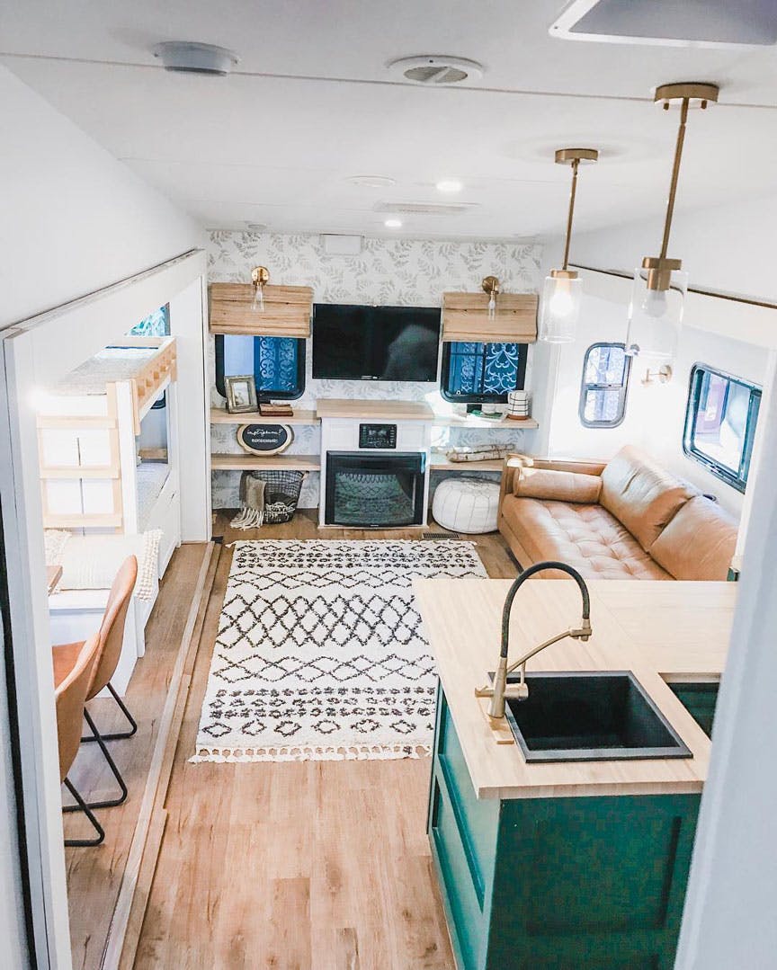 Renovated RV tiny home with woven wood shades