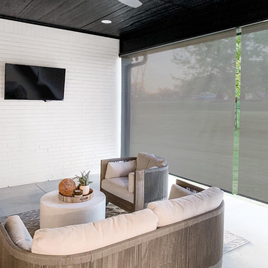 patio with heavy duty outdoor shades and patio furniture