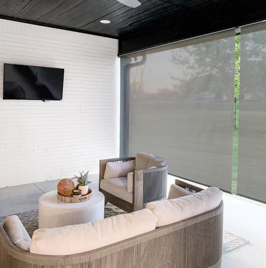 patio with heavy duty outdoor shades and patio furniture