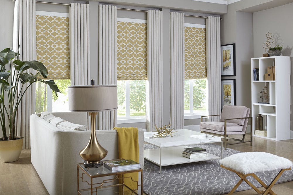 formal living room with yellow shades on windows