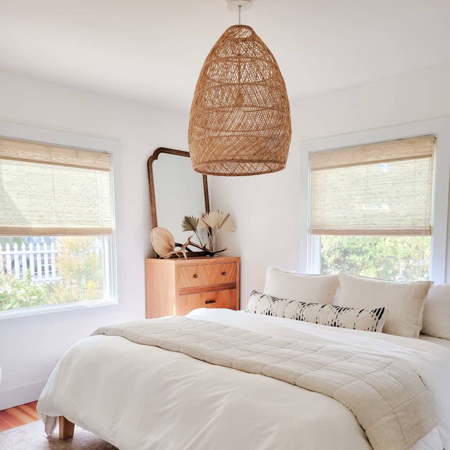 clean bedroom with premium woven wood shades on the windows