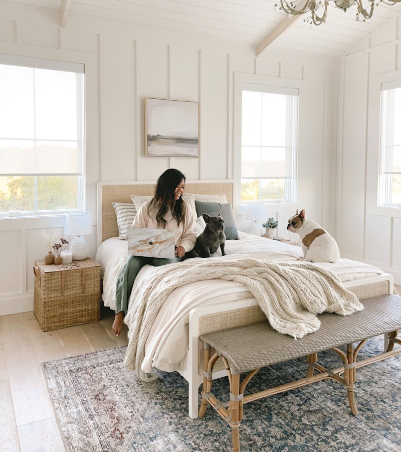 blinds.com motorized solar shade bedroom window coverings in an all white bedroom