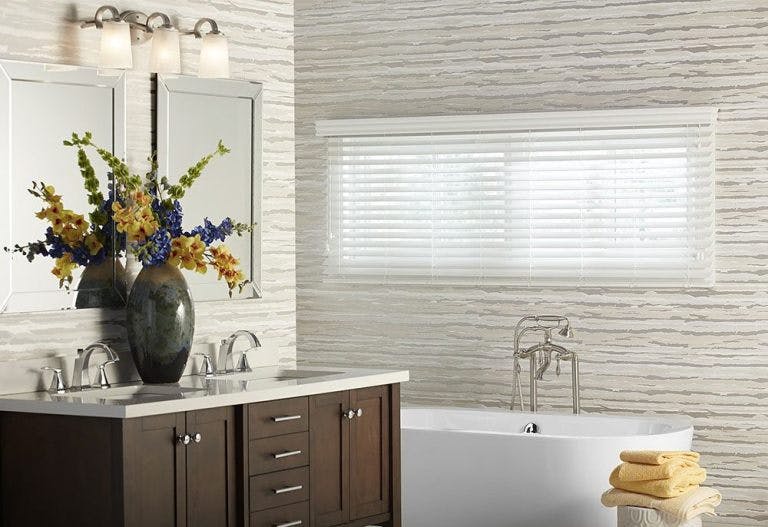 white faux wood blinds in a bathroom