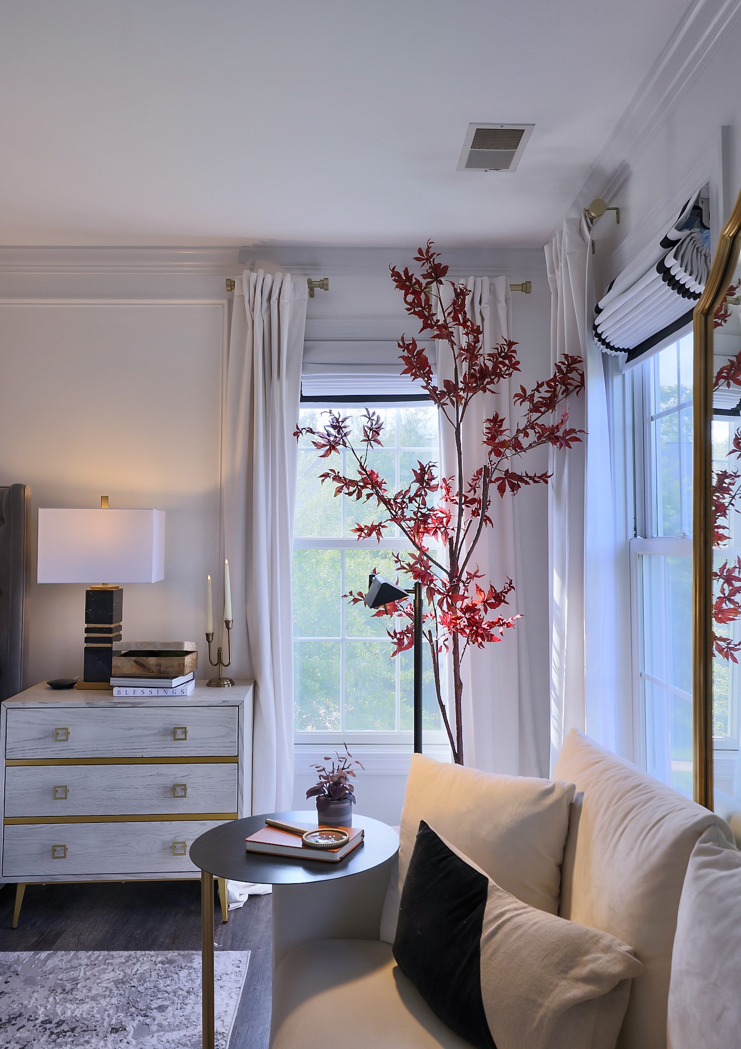 a modern bedroom with Blinds.com roman shade bedroom window coverings