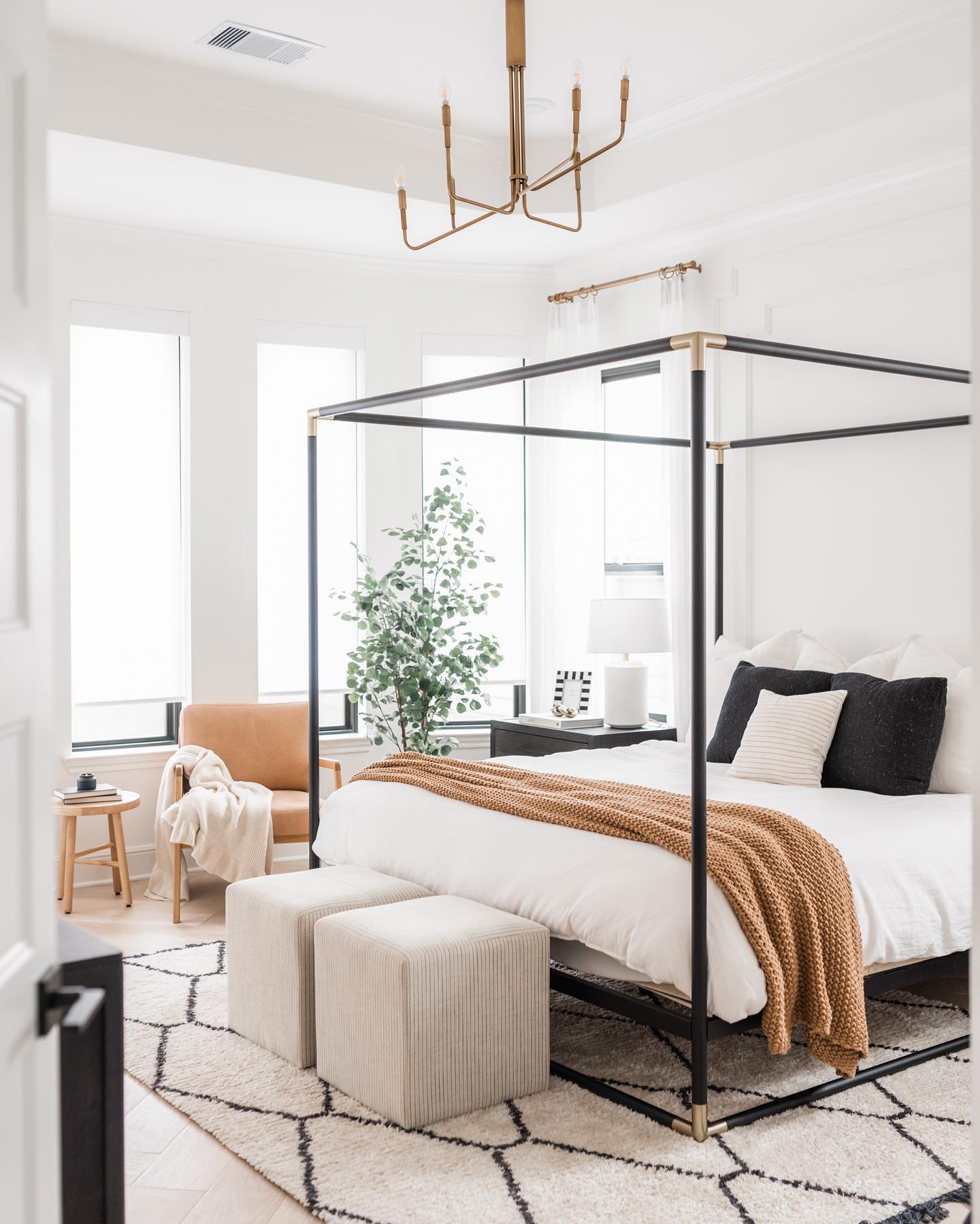 Annie Mescall's primary bedroom with Classic Light Filtering Roller Shades on the windows