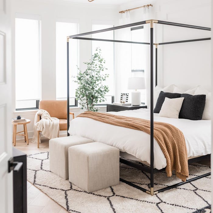 Annie Mescall's primary bedroom with Classic Light Filtering Roller Shades on the windows