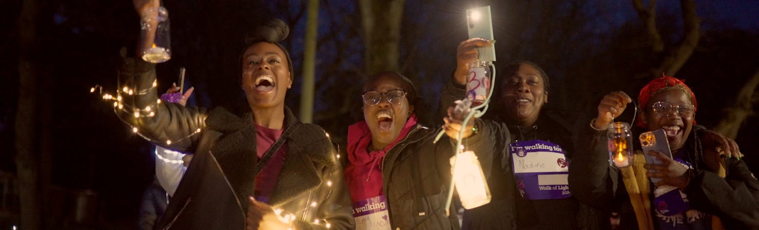 Nadine smiling with a friend during walk of light