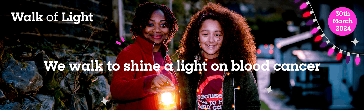 A Mum and daughter holding a glowing lantern standing by a stone wall outside with “We walk to shine a light on blood cancer” written over