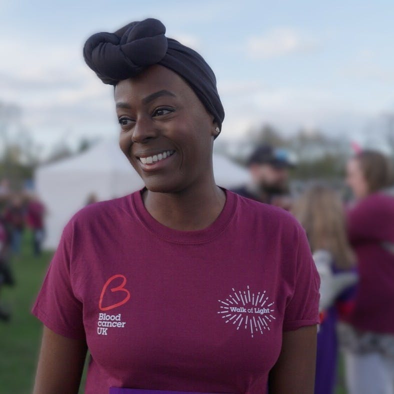 Close-up of Nadine smiling in a Blood Cancer UK t-shirt