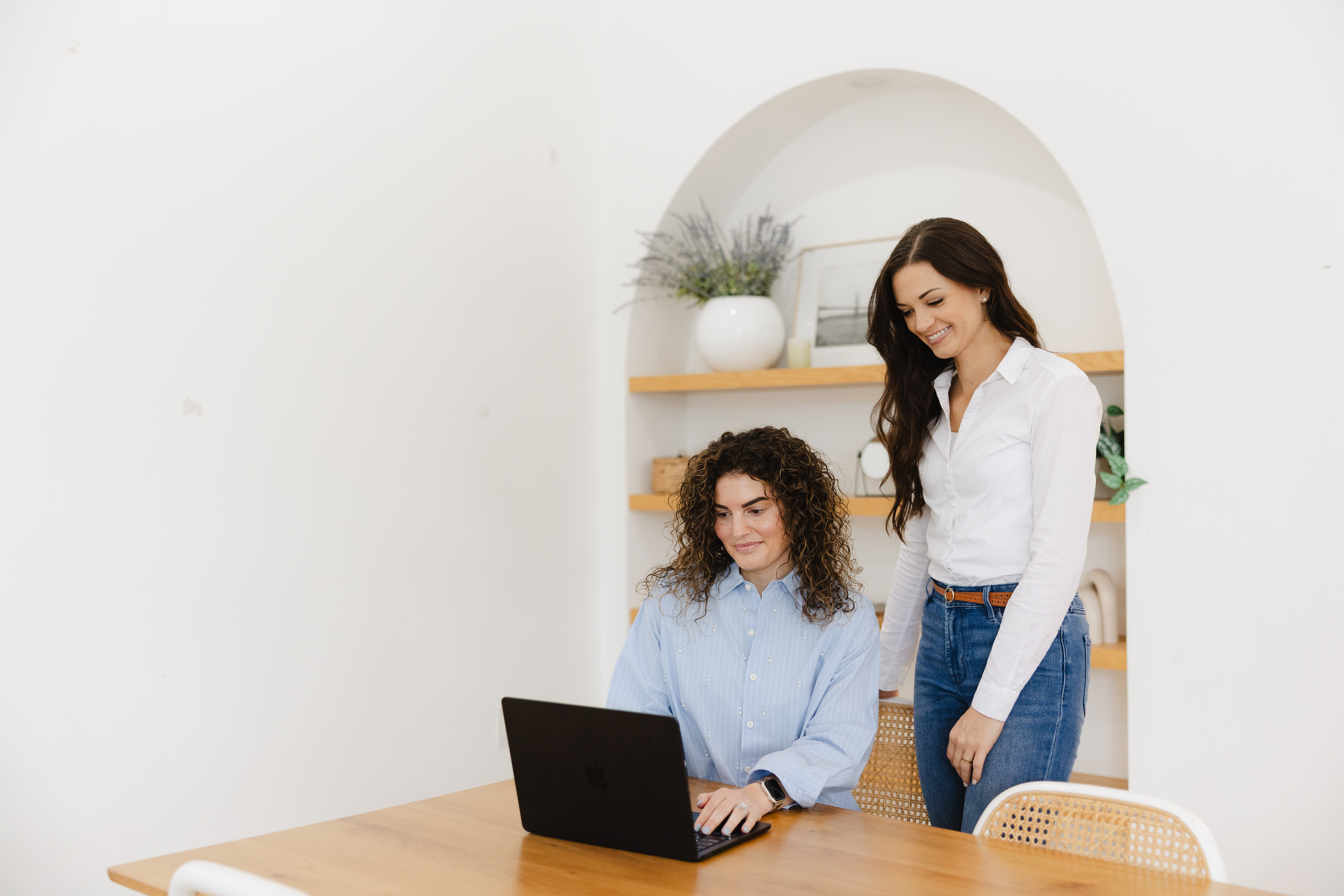 Person reviewing email marketing analytics on a laptop, showing strong open and click-through rates