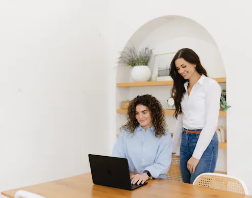 Person reviewing email marketing analytics on a laptop, showing strong open and click-through rates