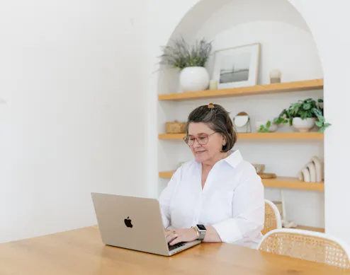 Business professional reviewing brand materials and a checklist, representing a Q4 brand audit