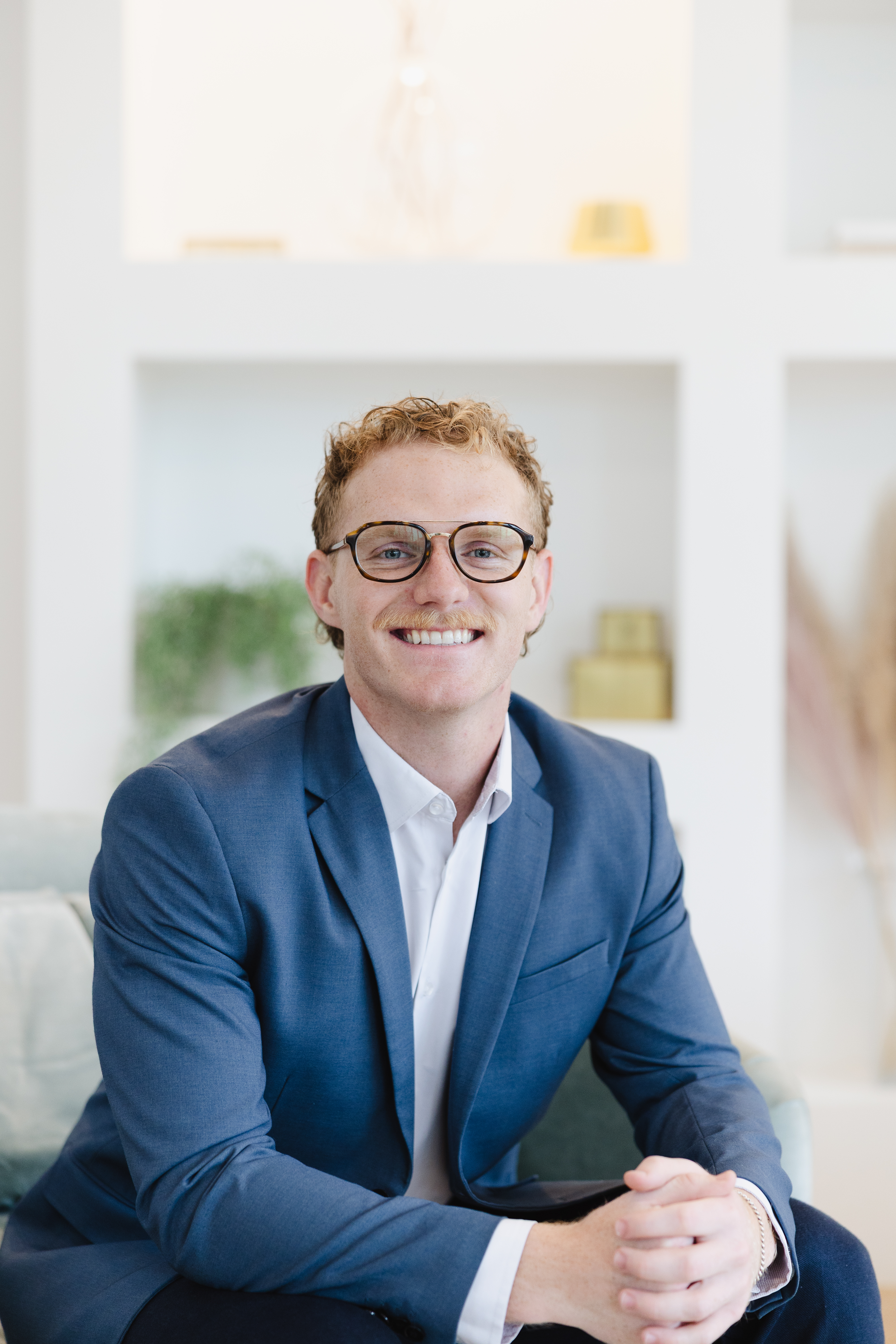 Carson Wicker Content and Graphic Designer headshot at company photoshoot