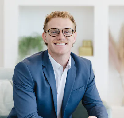 Carson Wicker Content and Graphic Designer headshot at company photoshoot