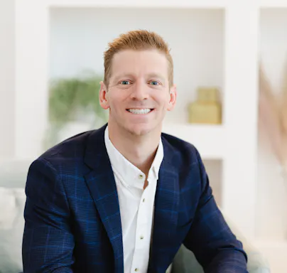 Max Klinedinst Vice President of Bluebird Creative headshot at company photoshoot