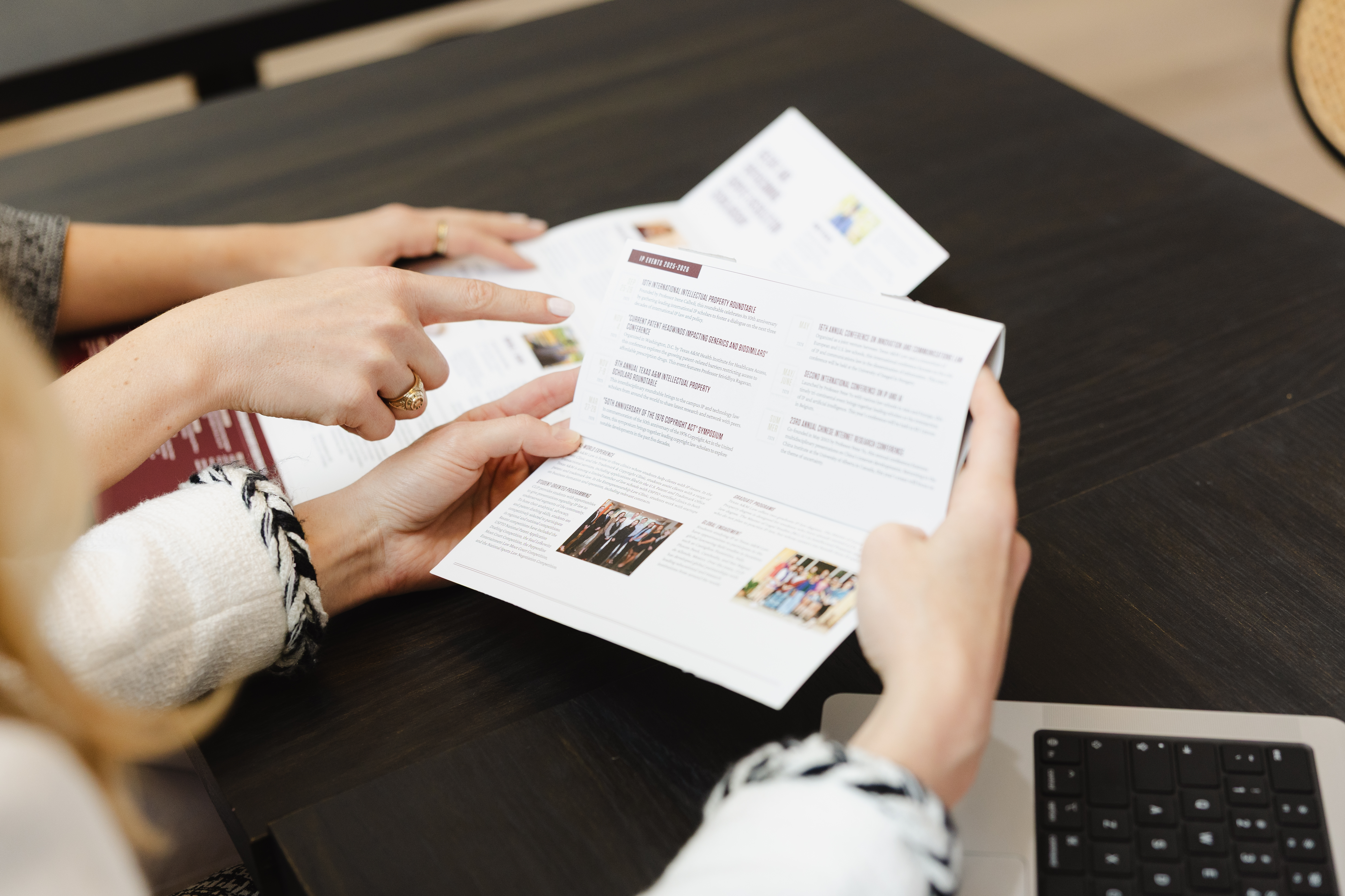 Marketer reviewing a whiteboard with keep, cut, and add columns for annual marketing planning