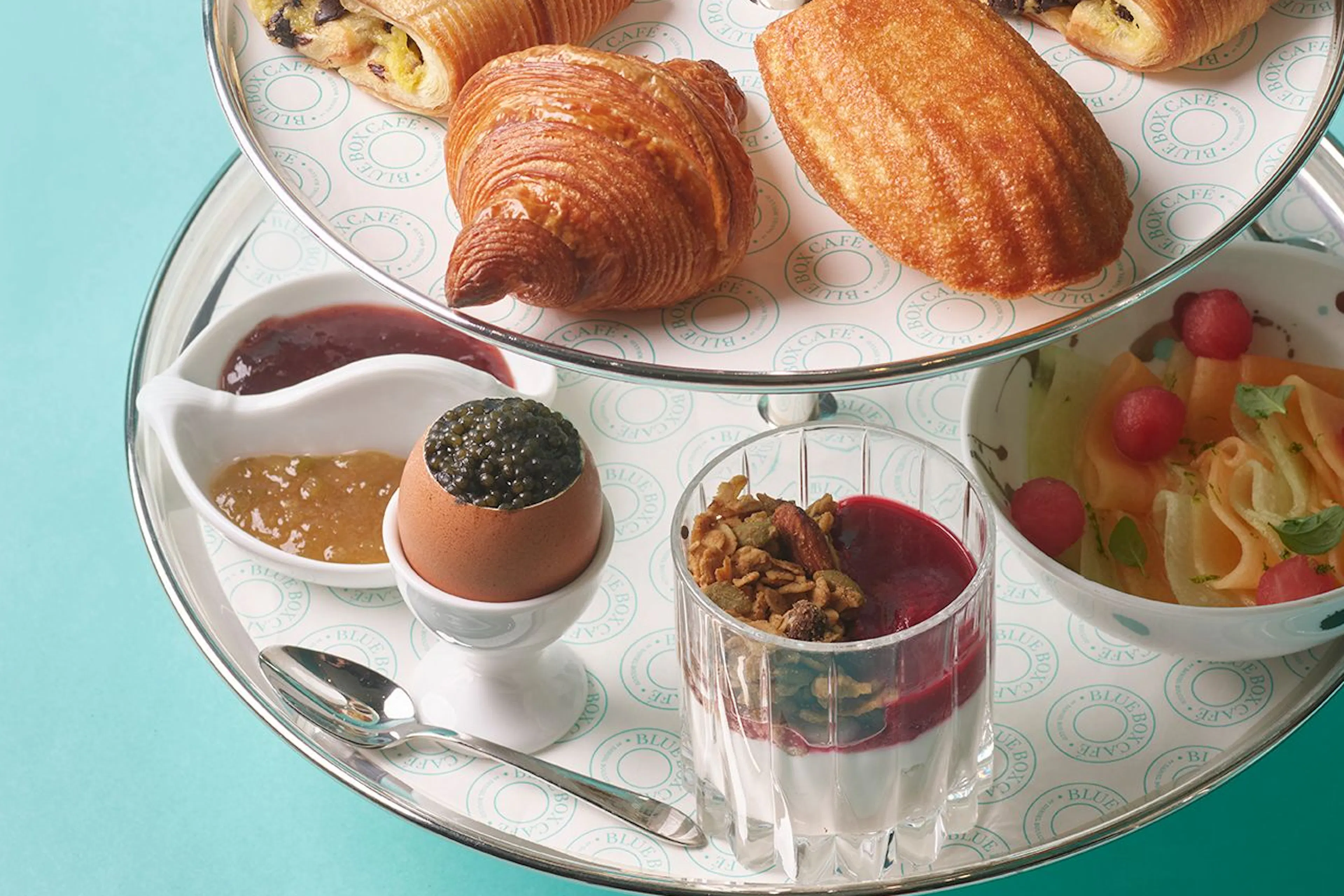 Iconic Breakfast at Tiffany’s tower at Blue Box Café at Tiffany & Co. South Coast Plaza with assorted pastries, fruit, preserves, and breakfast accompaniments.