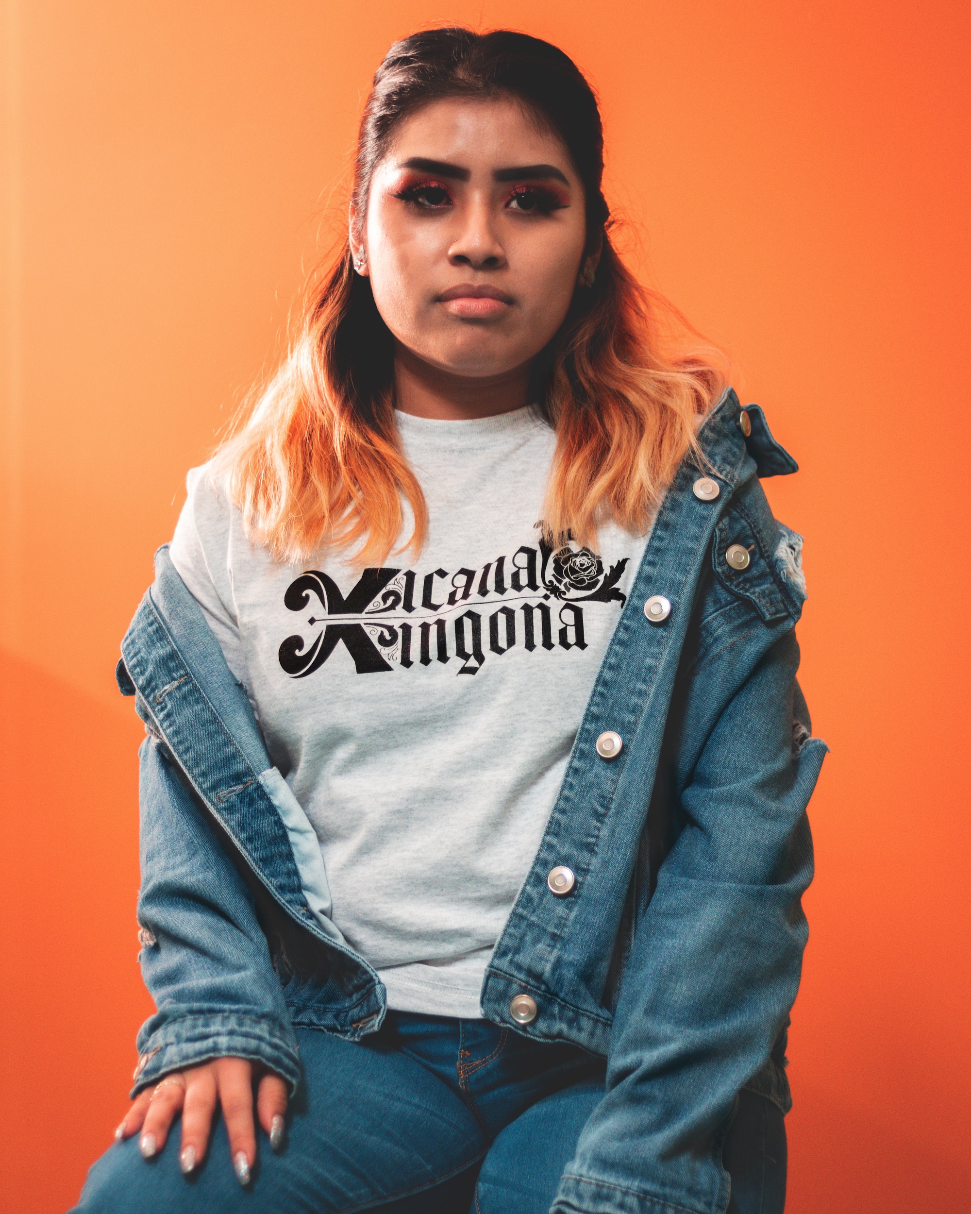 Latina wearing Xicana Xingona Shirt