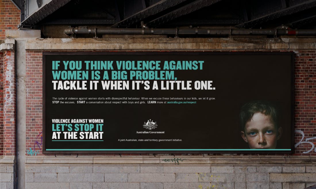 An image of a billboard on a brick wall. The text reads "If you think violence against women is a big problem, tackle it when it's a little one".