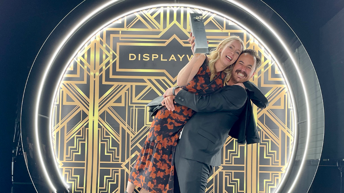 An image of two people celebrating.