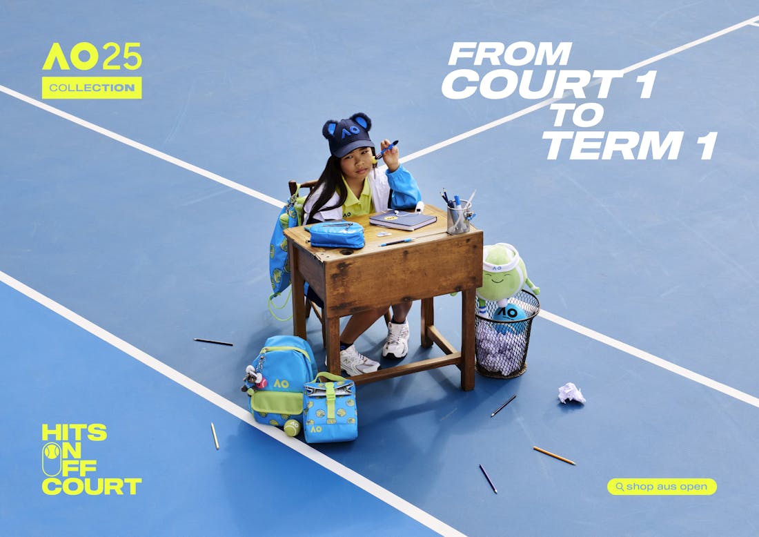 a girl decked out in AO merch sitting at a school desk in the middle of a tennis court