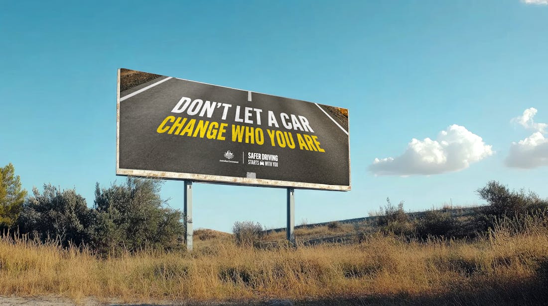billboard reading 'don't let a car change who you are'