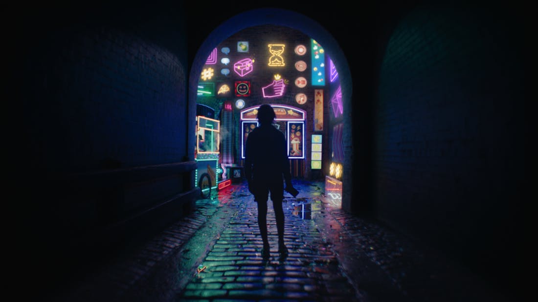 A boy standing in an alleyway facing a wall of neon emoji signs