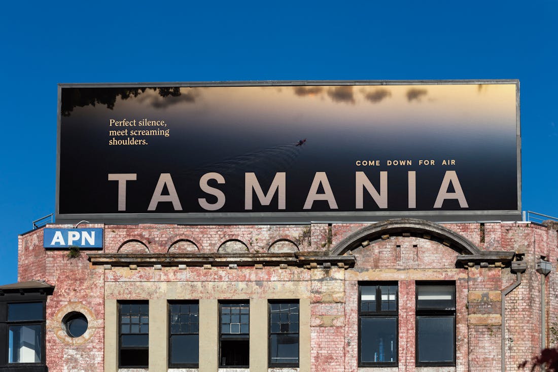 An image of a billboard advertisement for Tourism Tasmania. Come down for air.