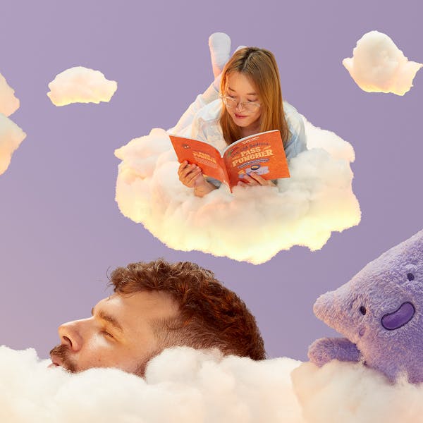 A vibrant image showing two people sitting on clouds reading books.