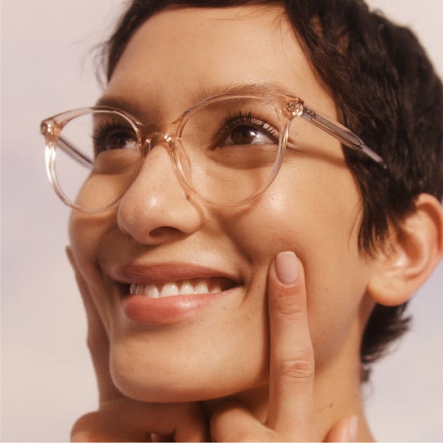 woman wearing glasses and smiling