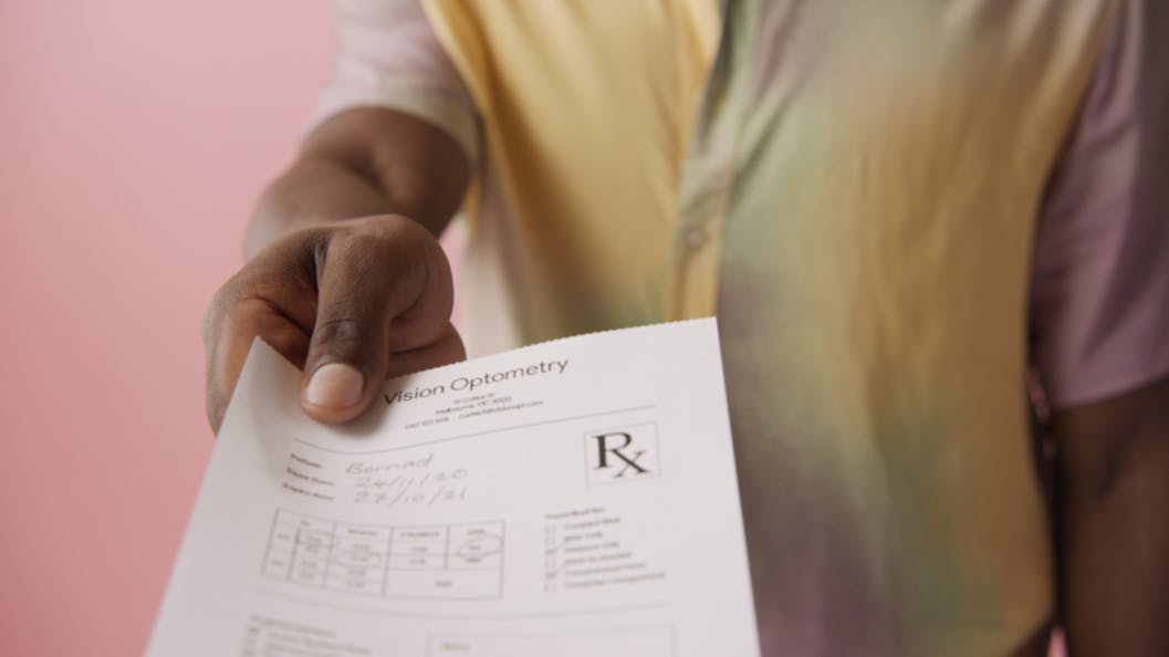 optical script being handed to patient