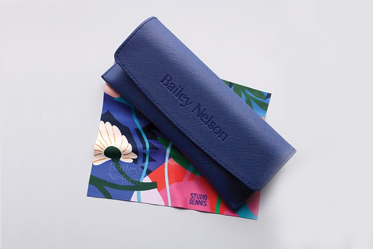 A blue Bailey Nelson glasses case and a floral design lens cloth