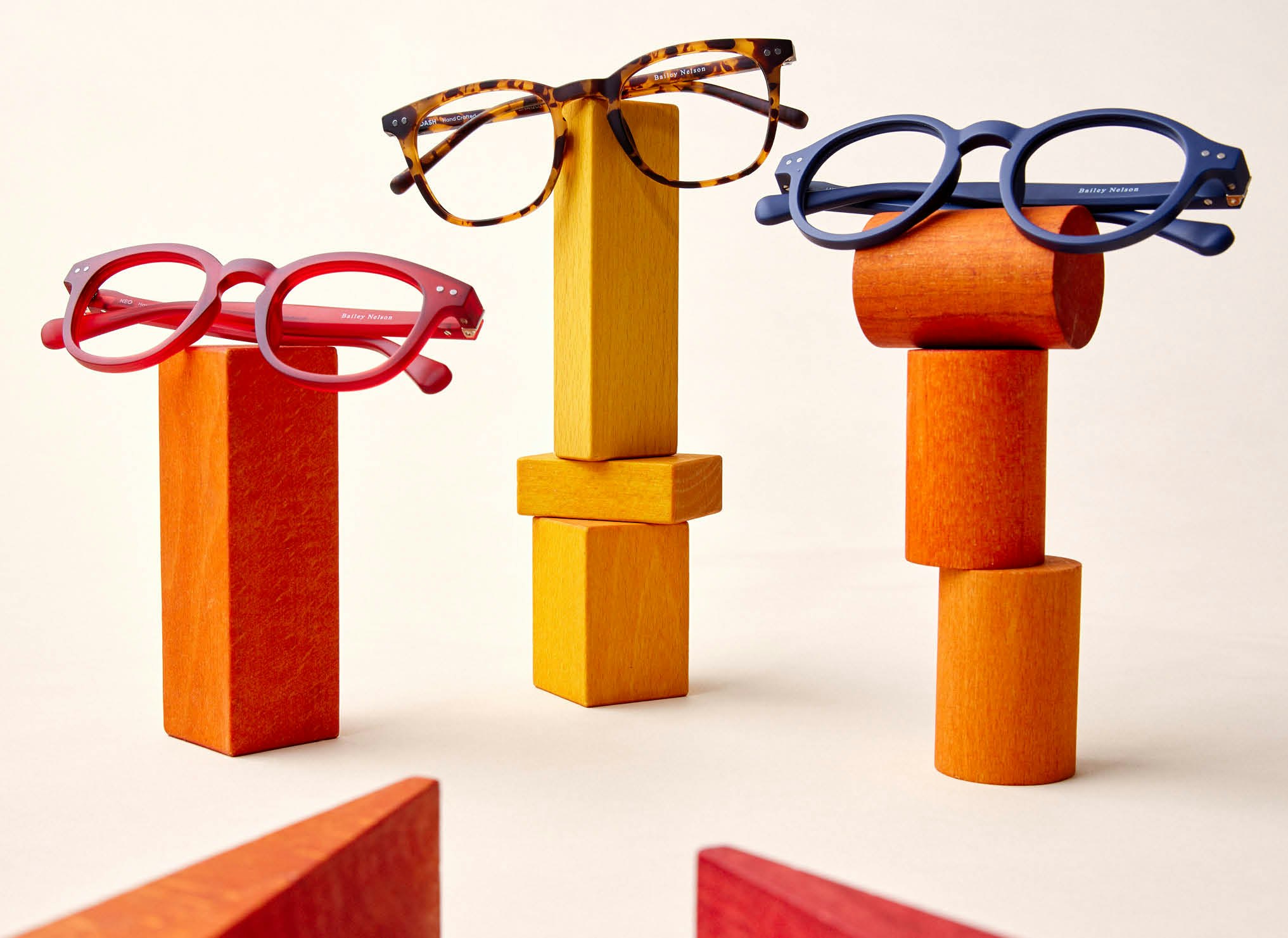 Bailey Nelson acetate kids frames displayed on colourful wooden blocks