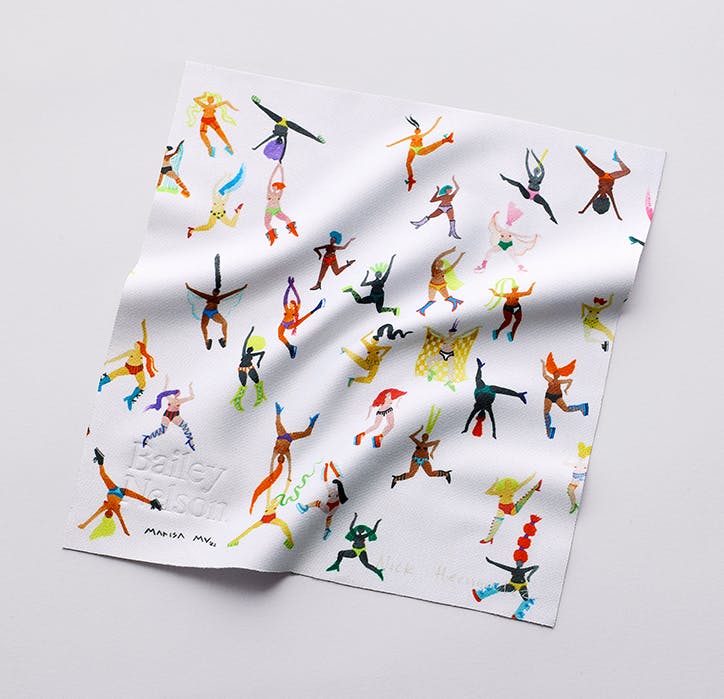 A lens cloth with colourful illustrated women jumping and dancing designed by Marisa Mu.