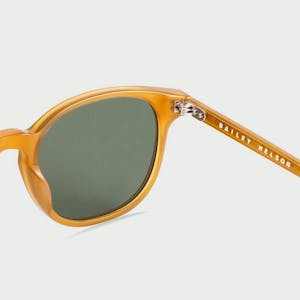 Back of the lens of the Palmer round yellow acetate Bailey Nelson sunglasses in Caramel