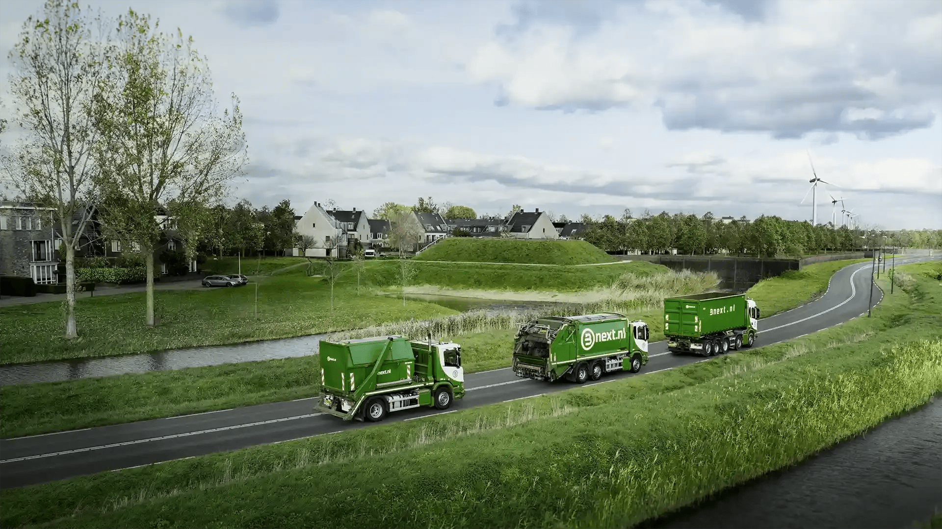 Drie vrachtwagens in een groene omgeving