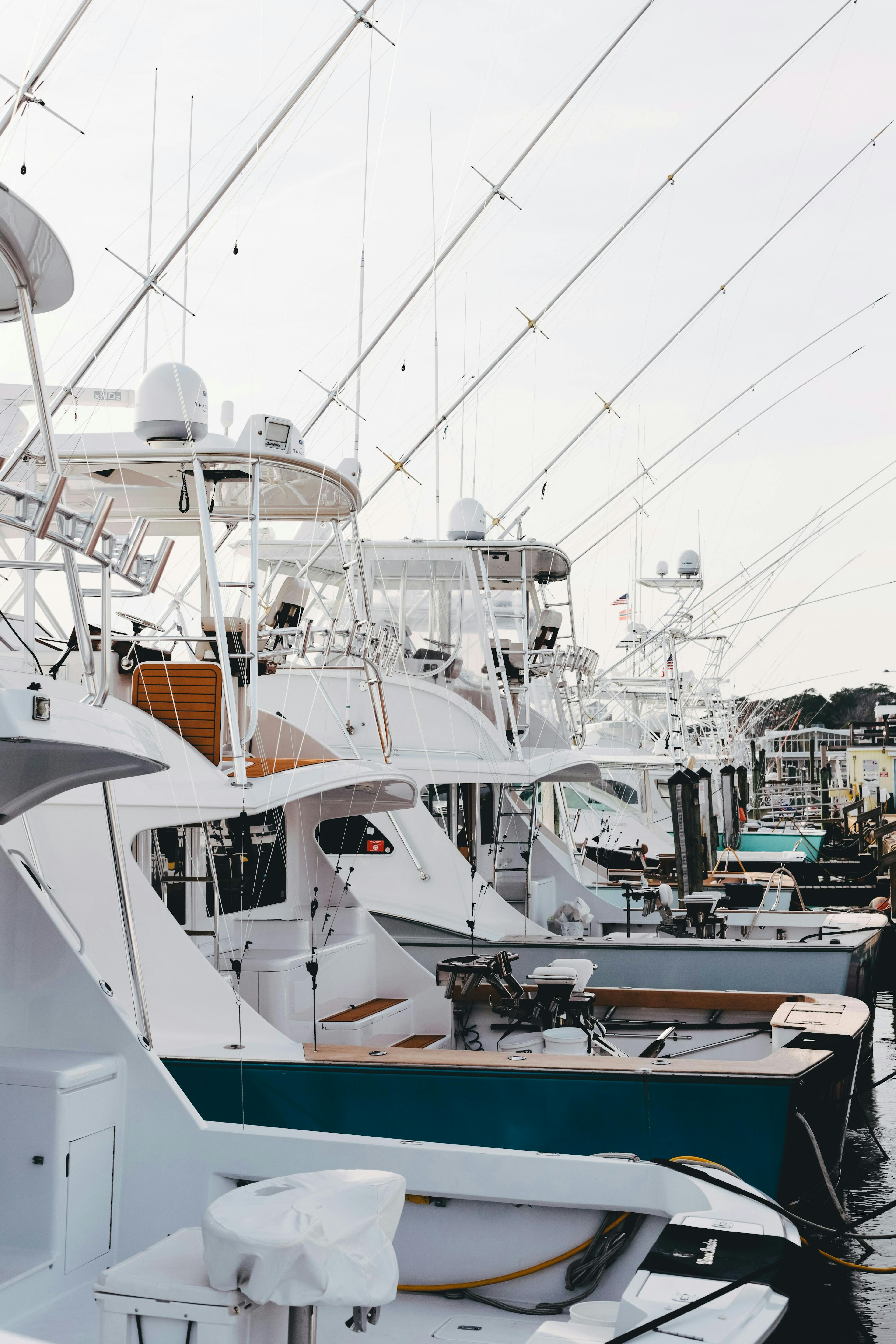 new white yachts docked at a marina. Understanding Pontoon Boat Costs: A Comprehensive Guide