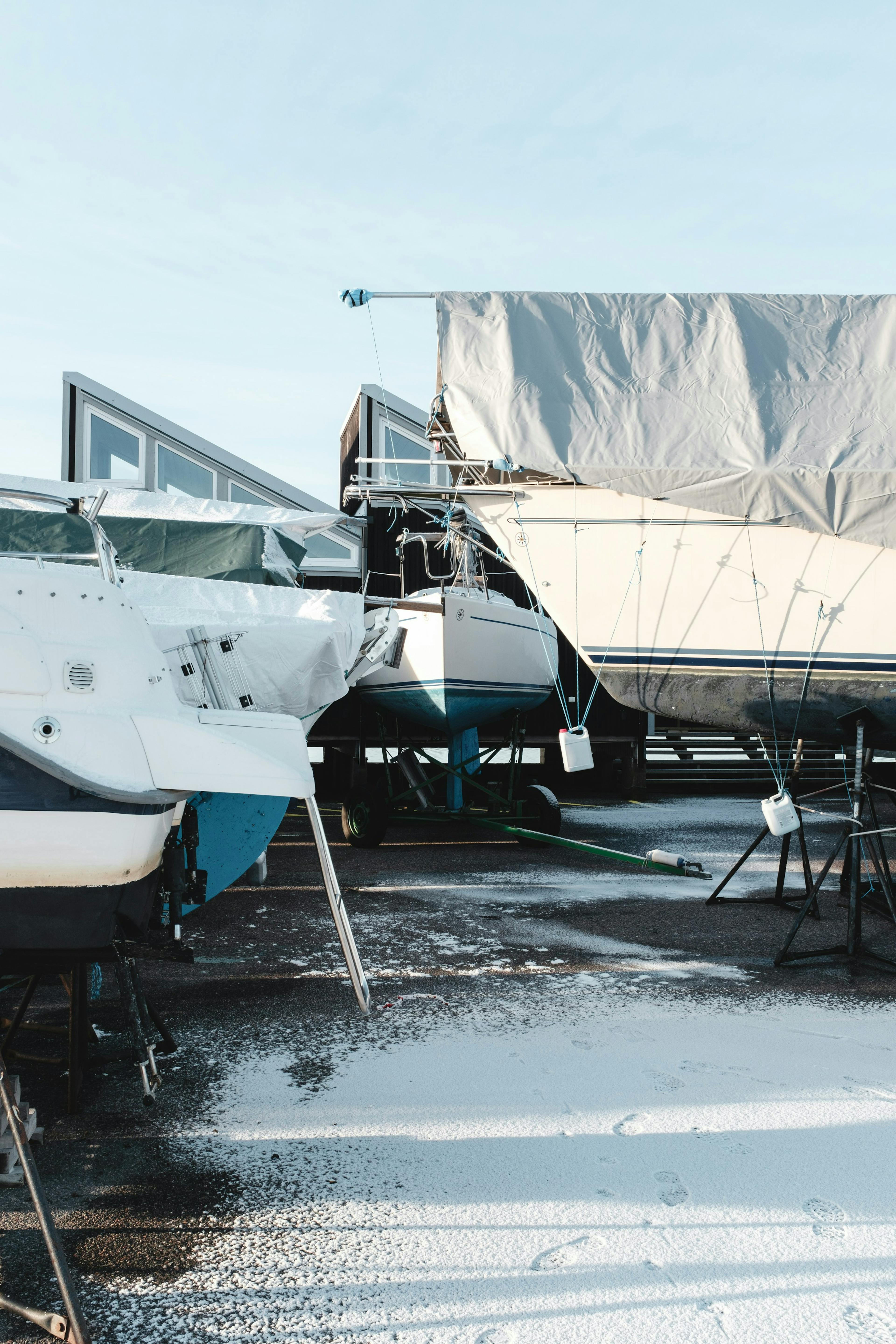 covered boats during the winter time. Winterizing Your Boat: A Cost Overview