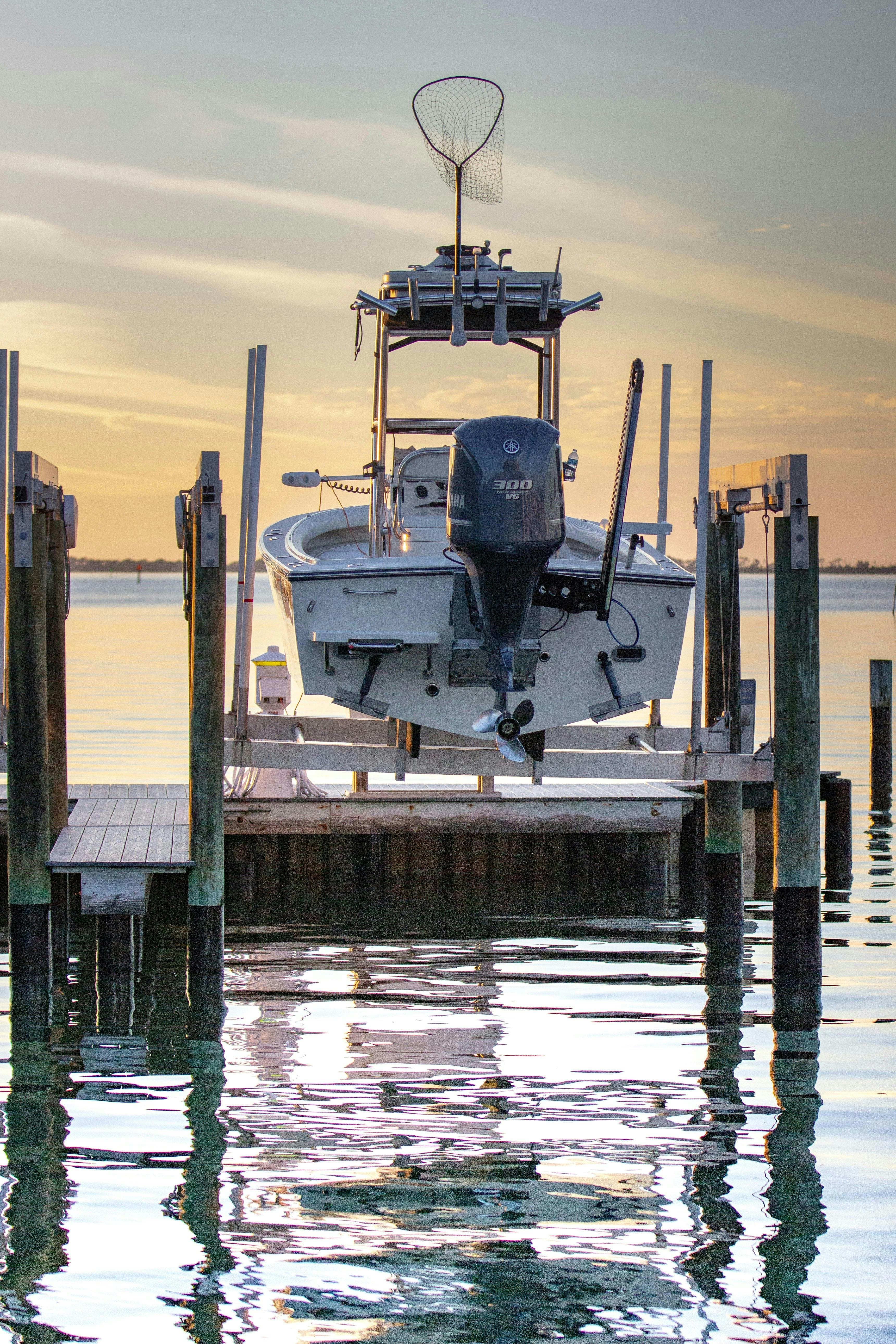 boat on the shore, sunset late, pontoon