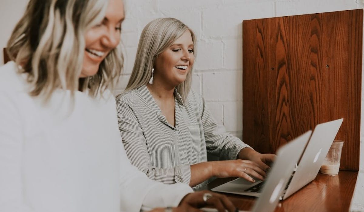 Two women working together