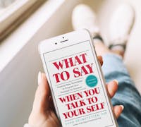 Lady reading: What to Say When You Talk to Yourself
