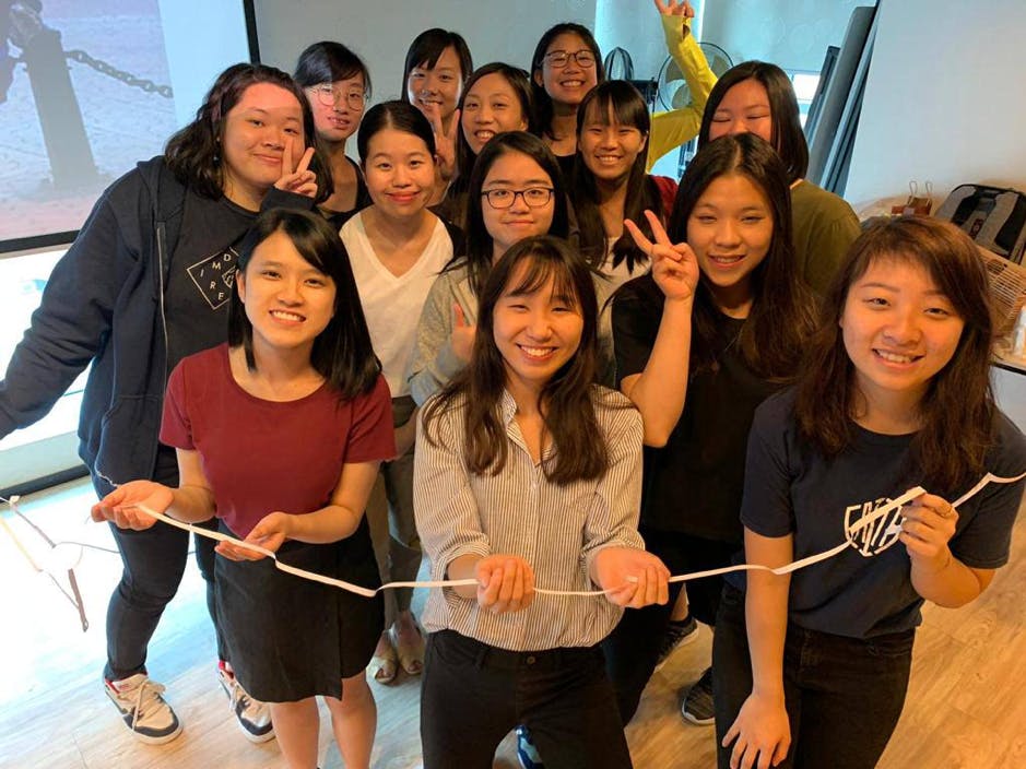 Group of young women smiling on camera