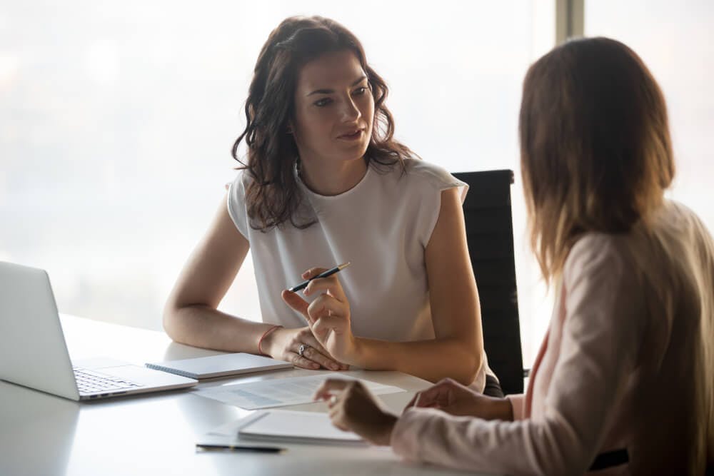 female career coach talking to client