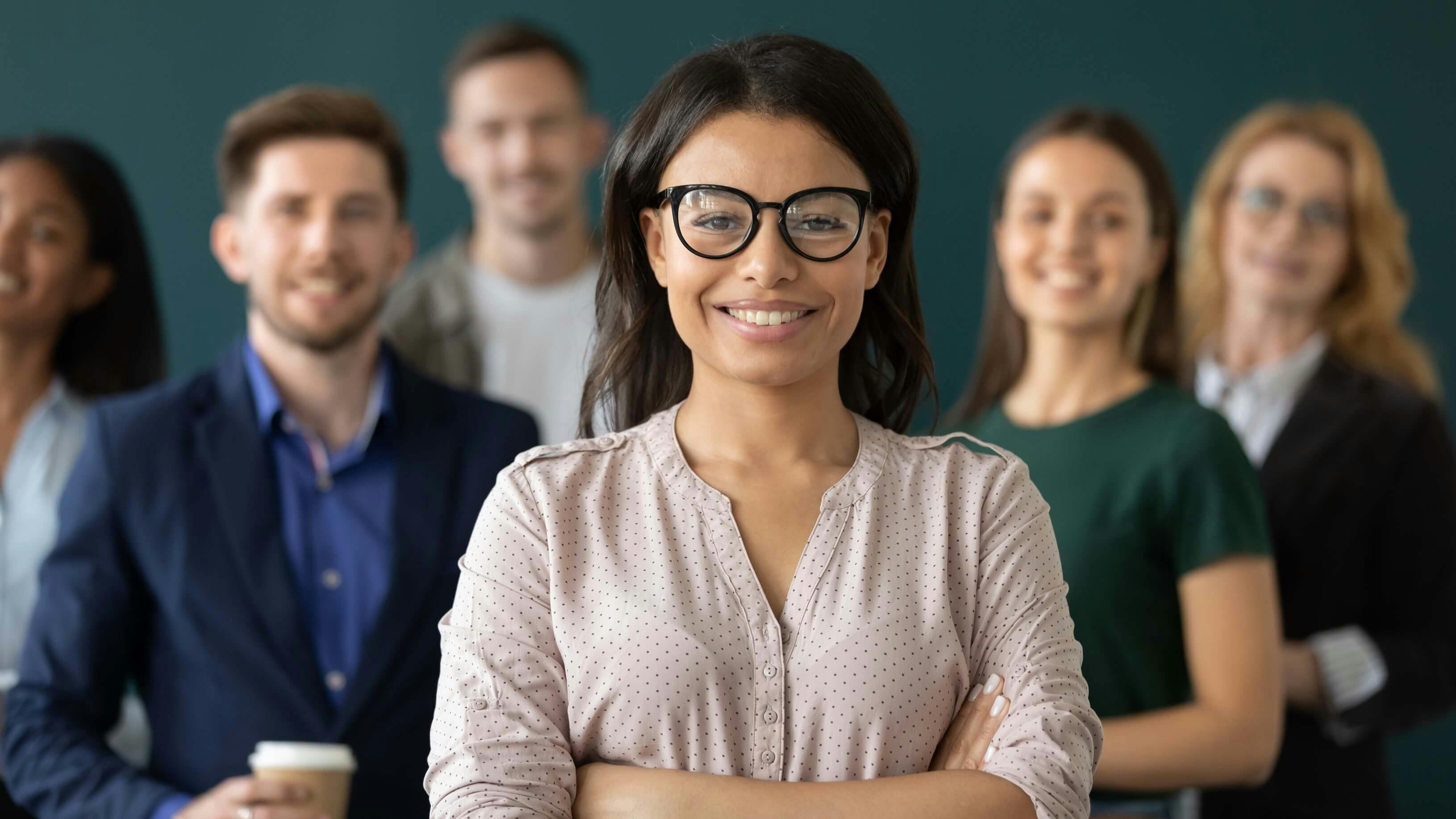 female supervisor standing in front of the team